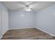 Simple bedroom with wood-look floors, double closet, and neutral colors, offering a blank canvas at 223 Tennessee Trl, Lincolnton, NC 28092