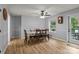 The dining room is bright and airy, featuring a ceiling fan and hardwood floors at 223 Tennessee Trl, Lincolnton, NC 28092