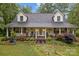 Charming home with a welcoming front porch and beautifully landscaped front yard at 223 Tennessee Trl, Lincolnton, NC 28092