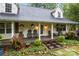Inviting front porch with decorative plants and cozy seating, perfect for relaxing at 223 Tennessee Trl, Lincolnton, NC 28092