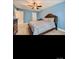 Spacious bedroom with a ceiling fan, light blue walls, carpet, and ample natural light at 2234 Donnington Nw Ln, Concord, NC 28027