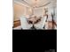 Elegant dining room featuring hardwood floors, statement lighting, and a modern dining set at 2234 Donnington Nw Ln, Concord, NC 28027