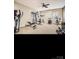 Brightly lit home gym with various exercise machines and equipment for a comprehensive workout at 2234 Donnington Nw Ln, Concord, NC 28027