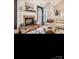 Cozy living room featuring a fireplace, neutral furniture, and plenty of natural light at 2234 Donnington Nw Ln, Concord, NC 28027