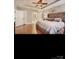 Spacious main bedroom with a tray ceiling, hardwood floors, and ensuite bathroom at 2234 Donnington Nw Ln, Concord, NC 28027