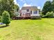 Beautiful backyard with deck, offering great space and serene views at 2325 Perry Rd, Denver, NC 28037