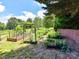 Backyard garden featuring raised garden beds and mature trees at 2325 Perry Rd, Denver, NC 28037