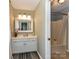 Bathroom features a double sink vanity with a view of a shower/tub combination at 2325 Perry Rd, Denver, NC 28037