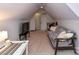 Attic bedroom featuring a zebra-print sofa and carpeted floor at 2325 Perry Rd, Denver, NC 28037