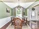 Dining room with hardwood flooring, chandelier, and ample natural light, perfect for Gathering gatherings and entertaining at 2325 Perry Rd, Denver, NC 28037
