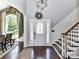 Elegant foyer with a staircase, hardwood floors, and a decorative front door with sidelights at 2325 Perry Rd, Denver, NC 28037