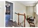 A bright hallway with wood-trimmed stairs leading to the dining room, showcasing a warm and inviting space at 2325 Perry Rd, Denver, NC 28037