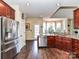 Spacious kitchen with stainless steel appliances, granite countertops, and an open view to the dining area at 2325 Perry Rd, Denver, NC 28037