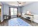 Cozy living room with a chair, side tables, and a stylish area rug at 2325 Perry Rd, Denver, NC 28037