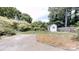 Landscaped backyard featuring a shed and a brick patio at 2507 Birnen Dr, Charlotte, NC 28210