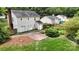 Aerial view of the backyard with a patio and landscaped garden at 2507 Birnen Dr, Charlotte, NC 28210