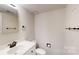 Bathroom featuring a white vanity, toilet, and minimal decor with light walls at 2507 Birnen Dr, Charlotte, NC 28210
