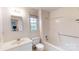 Bathroom featuring white vanity, mirror, and shower-tub combo at 2507 Birnen Dr, Charlotte, NC 28210