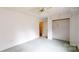 Bedroom with neutral walls, fan, closet, and green carpet at 2507 Birnen Dr, Charlotte, NC 28210