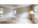 Spacious bedroom with neutral walls, ceiling fan, and natural light at 2507 Birnen Dr, Charlotte, NC 28210