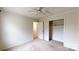 Neutral bedroom with ceiling fan, closet, and light carpet at 2507 Birnen Dr, Charlotte, NC 28210