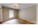 Cozy bedroom featuring a window that provides plenty of natural light and neutral walls at 2507 Birnen Dr, Charlotte, NC 28210