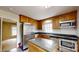 Updated kitchen with stainless steel appliances, wooden cabinets, and center island with an adjacent room at 2507 Birnen Dr, Charlotte, NC 28210