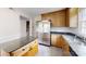 Updated kitchen features stainless steel appliances, wood cabinets, and center island with an adjacent room at 2507 Birnen Dr, Charlotte, NC 28210