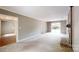 Expansive living room with a brick fireplace and access to another room and outdoor space at 2507 Birnen Dr, Charlotte, NC 28210