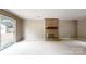 Spacious living room with a brick fireplace and a sliding door leading to the outdoors at 2507 Birnen Dr, Charlotte, NC 28210