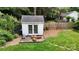 Exterior view of the backyard shed with double doors and gray roof at 2507 Birnen Dr, Charlotte, NC 28210