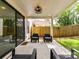 Inviting covered patio with outdoor seating, ideal for relaxing and entertaining in style at 2517 Marlowe Ave, Charlotte, NC 28208