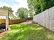 Spacious backyard featuring lush green grass and a tall privacy fence, great for outdoor enjoyment at 2517 Marlowe Ave, Charlotte, NC 28208