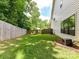 Well-maintained backyard with green grass and privacy fence, perfect for outdoor activities and relaxation at 2517 Marlowe Ave, Charlotte, NC 28208