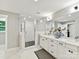 Bright bathroom with a glass-enclosed shower and a large vanity with double sinks at 2517 Marlowe Ave, Charlotte, NC 28208