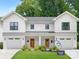 Charming two-story modern farmhouse with symmetrical design, inviting front porch, and well-manicured lawn at 2517 Marlowe Ave, Charlotte, NC 28208