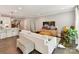 Open living room featuring hardwood floors, recessed lighting, neutral paint, and a comfortable white sofa at 2517 Marlowe Ave, Charlotte, NC 28208