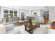 Bright and airy open-concept living room seamlessly blends into a modern kitchen and dining area for flexible living at 2517 Marlowe Ave, Charlotte, NC 28208
