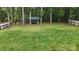 Landscaped backyard with tall trees and a shed at 2656 Lee Lawing Rd, Lincolnton, NC 28092
