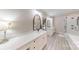 Modern bathroom with dual vanities, walk-in shower, and elegant mirrors for a stylish and functional space at 2656 Lee Lawing Rd, Lincolnton, NC 28092