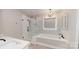 Stylish bathroom with walk-in shower, soaking tub, modern fixtures, and elegant lighting for a spa-like experience at 2656 Lee Lawing Rd, Lincolnton, NC 28092