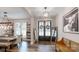 Welcoming foyer featuring a wood bench, mirror, and double doors leading to outdoor porch at 2656 Lee Lawing Rd, Lincolnton, NC 28092