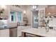 Well-appointed kitchen showcasing a farmhouse sink, patterned backsplash, and stainless steel appliances at 2656 Lee Lawing Rd, Lincolnton, NC 28092