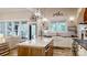 Spacious kitchen with island, white cabinets, stainless steel appliances, and open to the living area at 2656 Lee Lawing Rd, Lincolnton, NC 28092