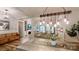 Open-concept living space with rustic wood dining table and view of the living room at 2656 Lee Lawing Rd, Lincolnton, NC 28092