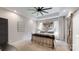 Elegant main bedroom showcasing a tray ceiling, modern ceiling fan, and refined details for ultimate comfort at 2656 Lee Lawing Rd, Lincolnton, NC 28092