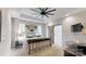 Spacious main bedroom featuring tray ceilings, a ceiling fan, and ensuite bathroom access via a sliding barn door at 2656 Lee Lawing Rd, Lincolnton, NC 28092