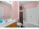 This bathroom features a shower and tub with white porcelain fixtures at 2809 Waycross Dr, Monroe, NC 28110