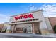 Exterior of a TJ Maxx store with a red sign and large glass entrance doors at 2809 Waycross Dr, Monroe, NC 28110