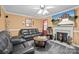 Inviting living room featuring a fireplace, comfortable seating, and a warm ambiance at 2809 Waycross Dr, Monroe, NC 28110